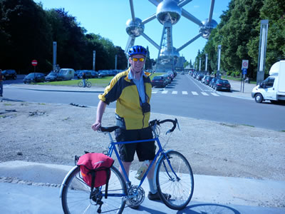 Alex Dowers poses in front of the Atomium in Brussels